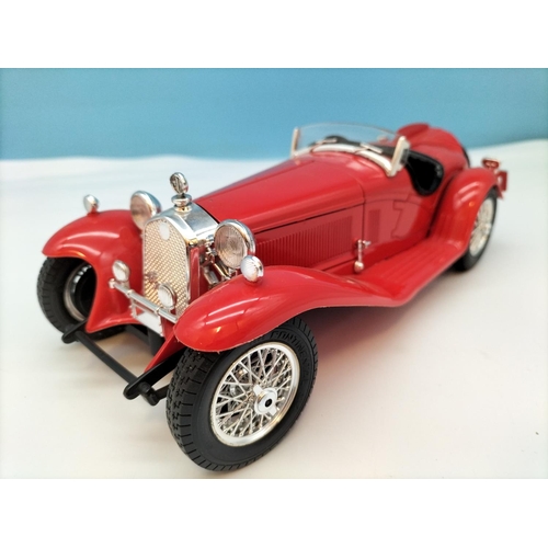 562 - Burago Die-Cast Cars (3) to include Ferrari and Alfa Romeo. Largest 8cm High, 25cm x 10cm.