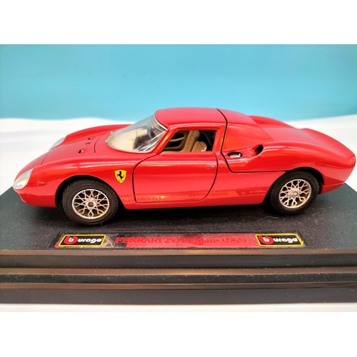 562 - Burago Die-Cast Cars (3) to include Ferrari and Alfa Romeo. Largest 8cm High, 25cm x 10cm.