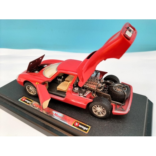 562 - Burago Die-Cast Cars (3) to include Ferrari and Alfa Romeo. Largest 8cm High, 25cm x 10cm.