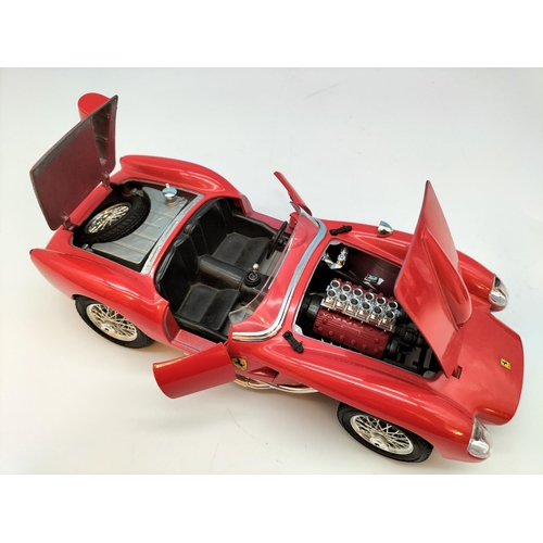 562 - Burago Die-Cast Cars (3) to include Ferrari and Alfa Romeo. Largest 8cm High, 25cm x 10cm.