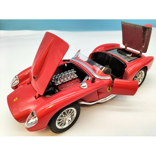 562 - Burago Die-Cast Cars (3) to include Ferrari and Alfa Romeo. Largest 8cm High, 25cm x 10cm.