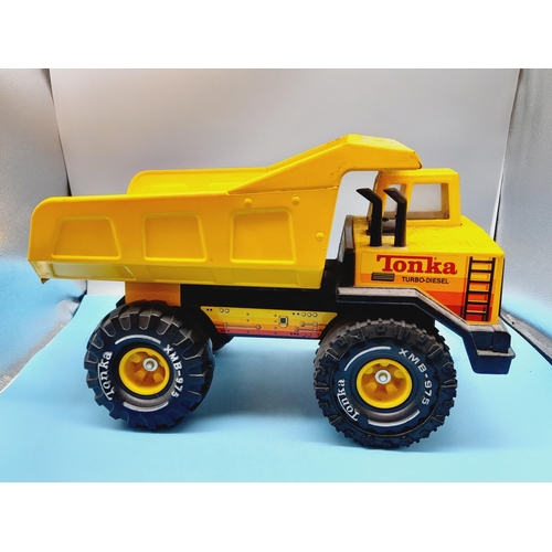 72 - Large c1980's XMB 975 Turbo Diesel Tipper Truck. 26cm High, 43cm x 20cm.