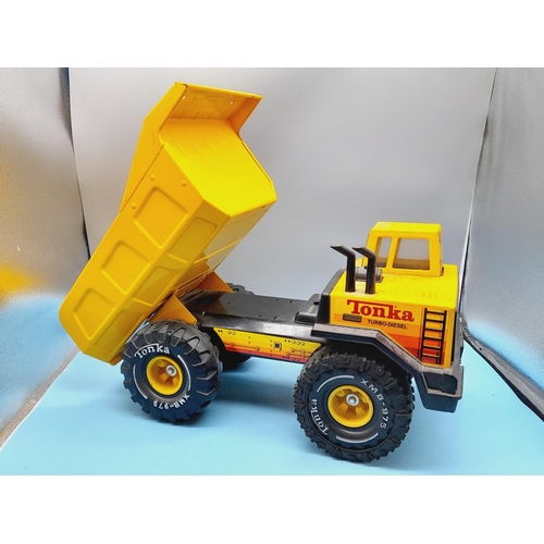 72 - Large c1980's XMB 975 Turbo Diesel Tipper Truck. 26cm High, 43cm x 20cm.