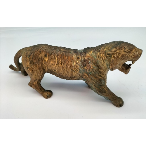 76 - Brass Figure of a Tiger. 10cm High, 25cm Long.