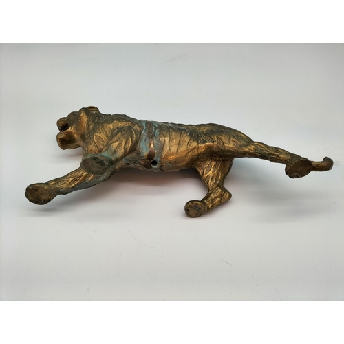 76 - Brass Figure of a Tiger. 10cm High, 25cm Long.