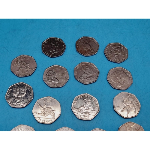 79 - Eighteen 50p Coins to include Peter Rabbit, Paddington Bear, Olympics, etc.