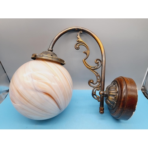 478 - Wall Mount Cast Metal Globe Light with Marbled Effect Glass Globe. 29cm High, 38cm x 20cm.