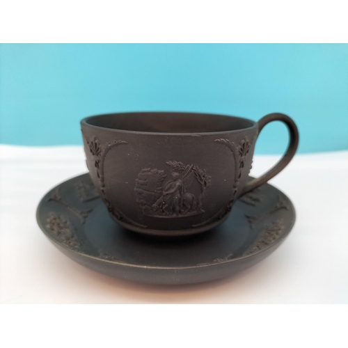 437 - Wedgwood Black Basalt Cup and Saucer with Classical Design.