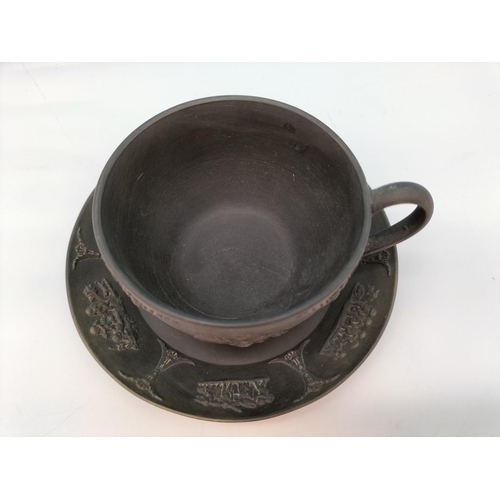 437 - Wedgwood Black Basalt Cup and Saucer with Classical Design.