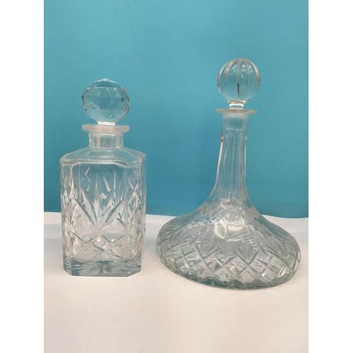 607 - Cut Glass Ship's Decanter plus Another Cut Glass Decanter. Tallest 30cm.