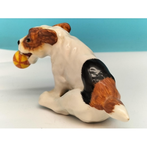 105 - Royal Doulton Dog Figure Running with Coloured Ball HN 1097. 12cm x 6cm.