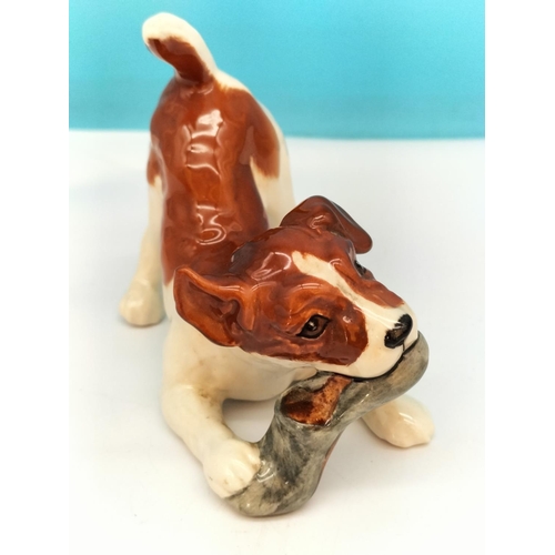 116 - Beswick Figure of Dog with Slipper. 11cm x 9cm.