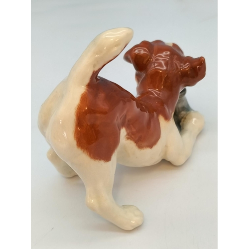 116 - Beswick Figure of Dog with Slipper. 11cm x 9cm.