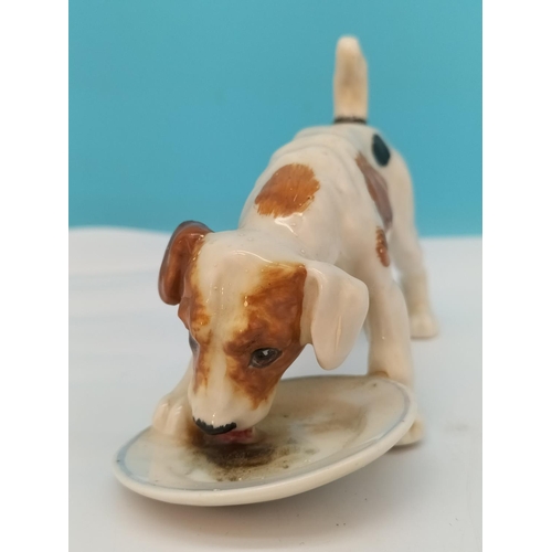 195 - Royal Doulton Figure of a Dog with Dish HN 1158. 13cm x 8cm. Seconds Quality.