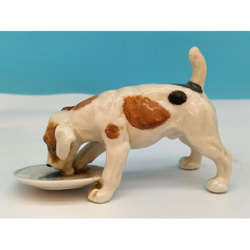 195 - Royal Doulton Figure of a Dog with Dish HN 1158. 13cm x 8cm. Seconds Quality.