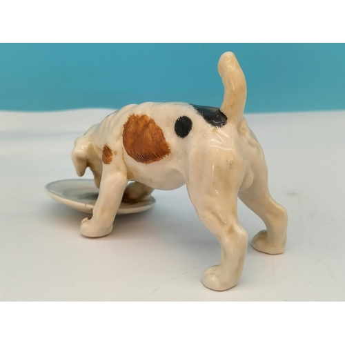 195 - Royal Doulton Figure of a Dog with Dish HN 1158. 13cm x 8cm. Seconds Quality.