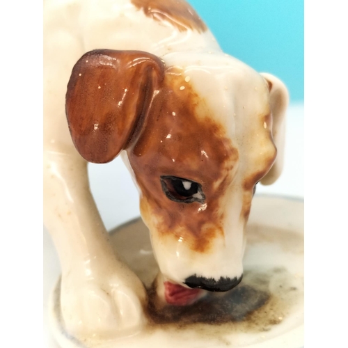 195 - Royal Doulton Figure of a Dog with Dish HN 1158. 13cm x 8cm. Seconds Quality.