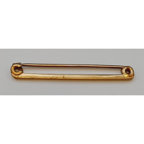 41 - 9ct Gold Pin Brooch. 1.4 Grams.