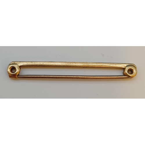 41 - 9ct Gold Pin Brooch. 1.4 Grams.