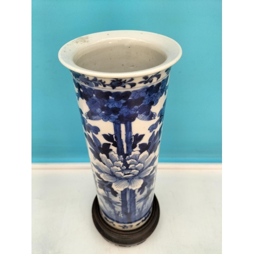 139 - 19th Century Blue and White Floral Decorated Vase on Carved Wooden Stand. Overall Height 28cm.