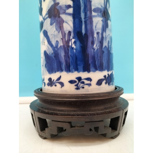 139 - 19th Century Blue and White Floral Decorated Vase on Carved Wooden Stand. Overall Height 28cm.