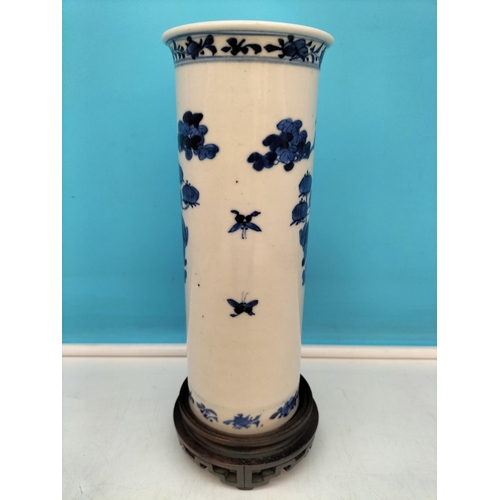 139 - 19th Century Blue and White Floral Decorated Vase on Carved Wooden Stand. Overall Height 28cm.