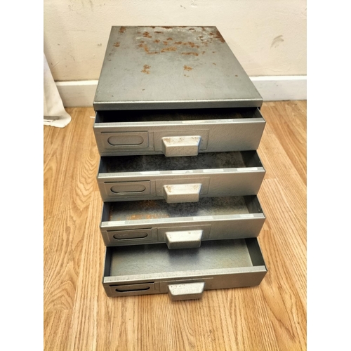 305 - Small 4 Drawer Metal Cabinet. 27cm High, 27cm x 39cm.