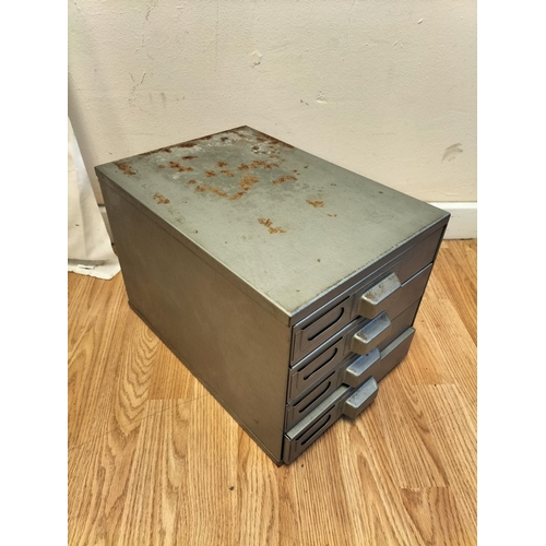 305 - Small 4 Drawer Metal Cabinet. 27cm High, 27cm x 39cm.