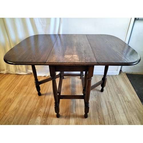 311 - Oak Drop Leaf Table. Closed 75cm High, 91cm x 42cm. Open 120cm. Collection Only.