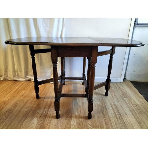 311 - Oak Drop Leaf Table. Closed 75cm High, 91cm x 42cm. Open 120cm. Collection Only.