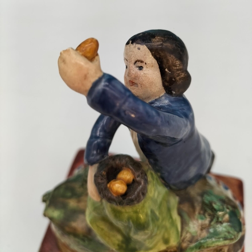 400 - Early Staffordshire c1780-1820 Pearlware Figure of a Boy Stealing Eggs. 16cm Tall.