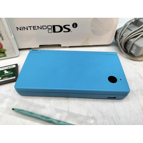 438 - Boxed Nintendo DSi Game System with 4 x Games W/O.