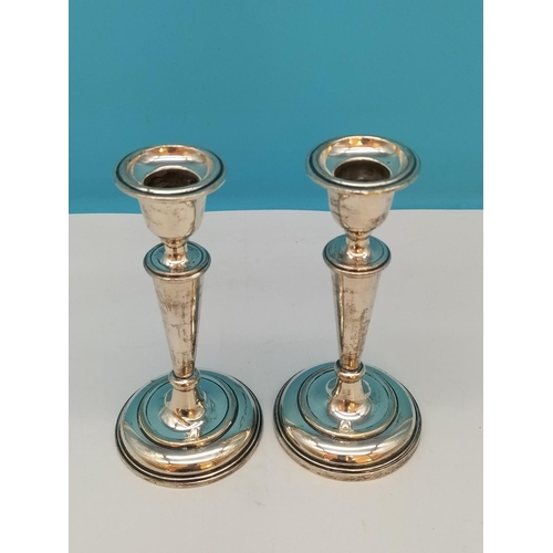 77 - Pair of Silver Hallmarked (Birmingham 1911) Candlesticks. Possibly by Sydney & Co. 15cm Tall.