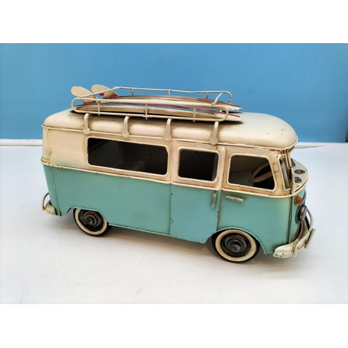 411 - Tin Plate Camper Van with Surf Boards on Top. 14cm high 27cm x 10cm.