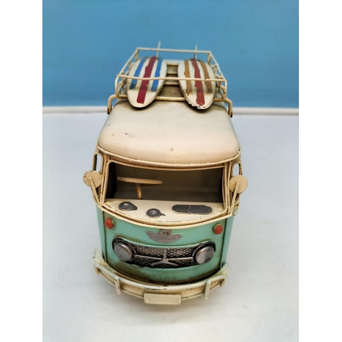 411 - Tin Plate Camper Van with Surf Boards on Top. 14cm high 27cm x 10cm.