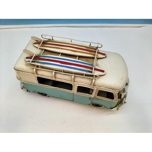 411 - Tin Plate Camper Van with Surf Boards on Top. 14cm high 27cm x 10cm.