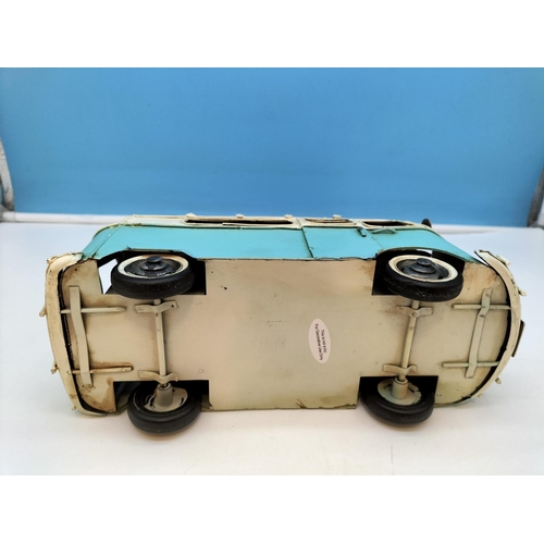 411 - Tin Plate Camper Van with Surf Boards on Top. 14cm high 27cm x 10cm.