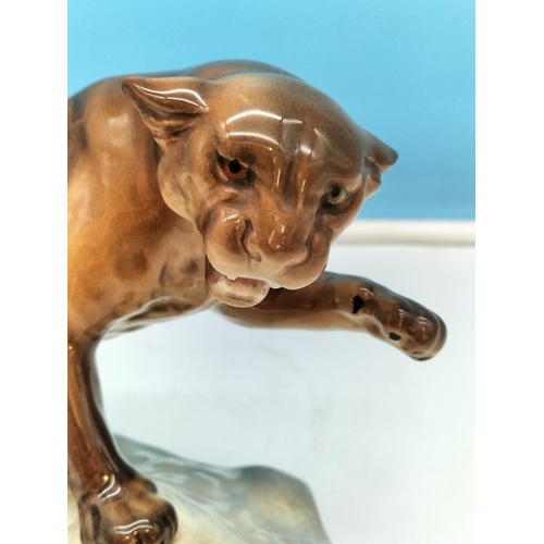 184 - Beswick Gloss Figure of a Puma on a Rock. Model 1823. 14cm High x 20cm.