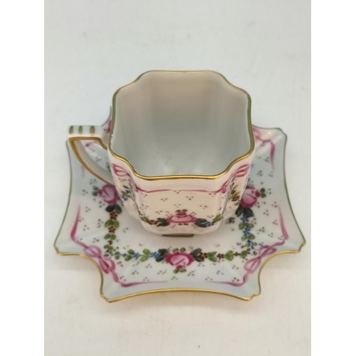 256 - Jacques Dumont (Limoges) Porcelain Hand Painted Cup and Saucer with Floral Garland Decoration c1911.