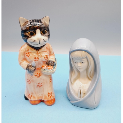 299 - Quail Pottery 14cm 'Cat Gardener' Figure plus a Spanish Porcelain Praying Madonna Figure.