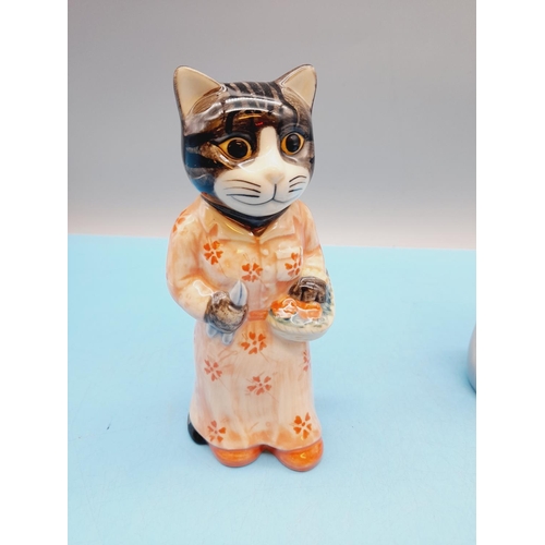 299 - Quail Pottery 14cm 'Cat Gardener' Figure plus a Spanish Porcelain Praying Madonna Figure.