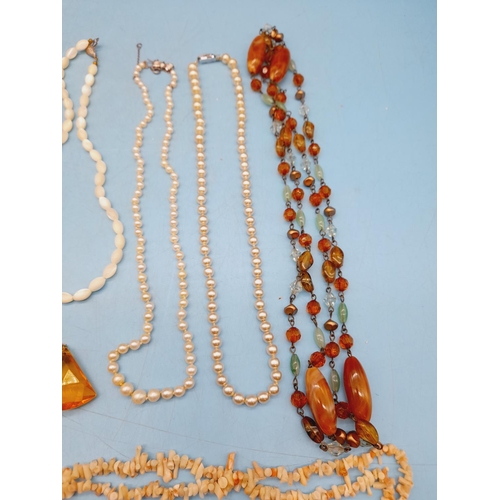 395 - Collection of Mixed Costume Jewellery to include Necklaces and Brooches.