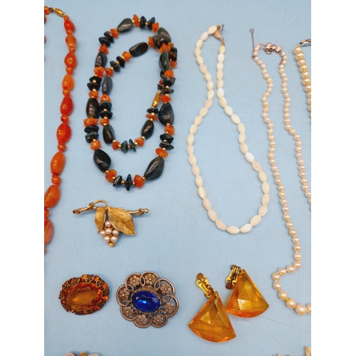 395 - Collection of Mixed Costume Jewellery to include Necklaces and Brooches.