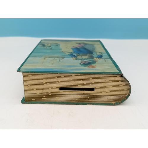 470 - Excellent Condition Chad Valley 'Westward Ho' Tin Money Box in the Shape of a Book with Key. 14.5cm ... 