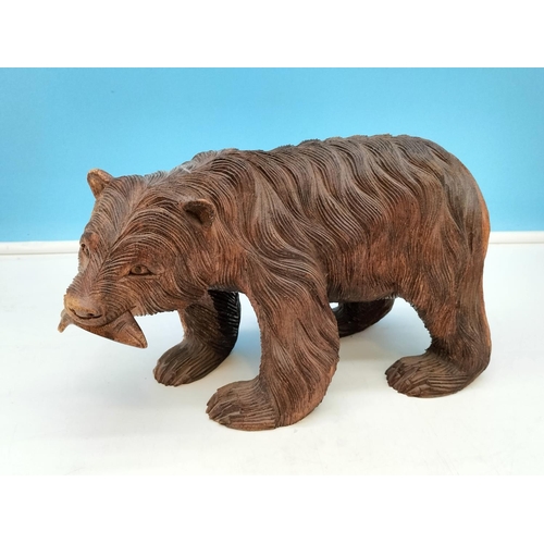 173 - Hand Carved Wooden Bear with Fish. 16cm High, 29cm x 14cm.