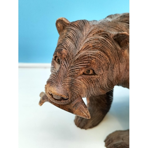 173 - Hand Carved Wooden Bear with Fish. 16cm High, 29cm x 14cm.