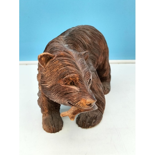 173 - Hand Carved Wooden Bear with Fish. 16cm High, 29cm x 14cm.