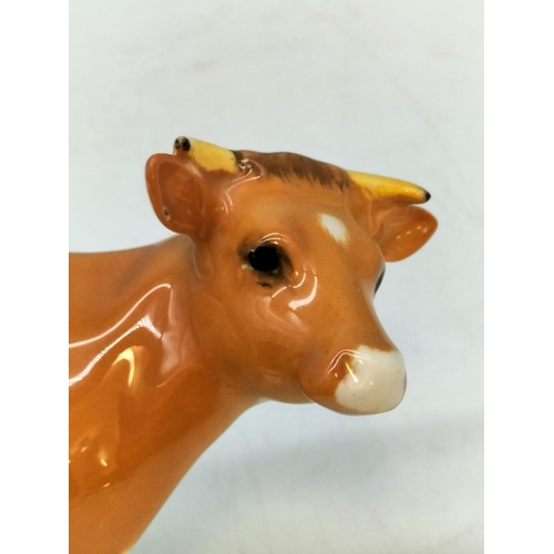 250A - Beswick figure of a Guernsey Cow. Nibble to Ear. 10cm High, 17cm x 5cm.