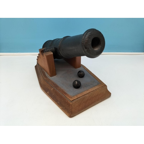 404 - Cast Metal Cannon on Wooden Stand with Cannonballs. 19cm High, 27.5cm x 17cm.