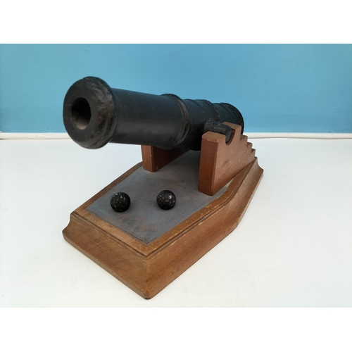 404 - Cast Metal Cannon on Wooden Stand with Cannonballs. 19cm High, 27.5cm x 17cm.